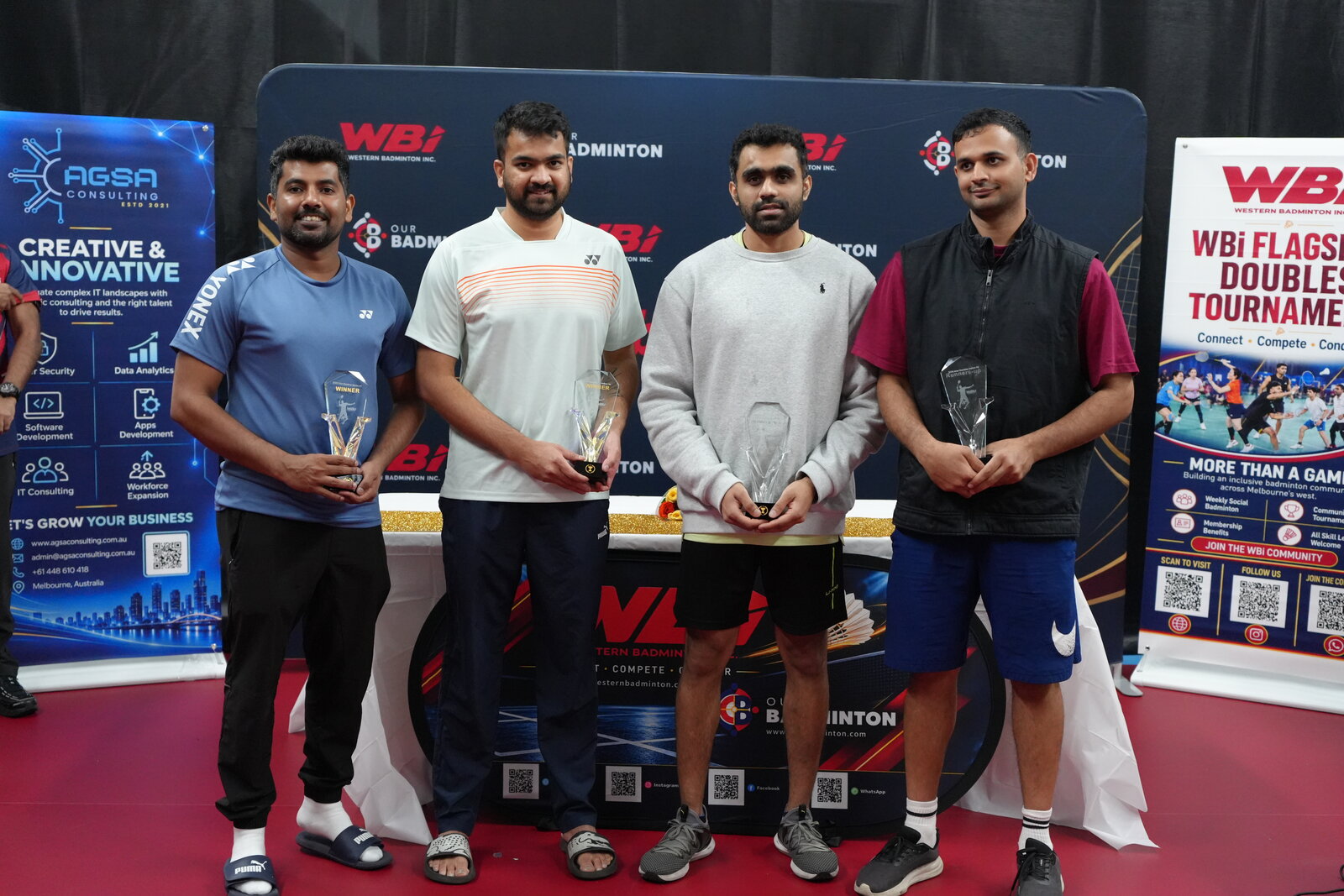 Men’s Doubles Below 40 winners and runners-up holding their trophies at the WBi Flagship Doubles Tournament 2026